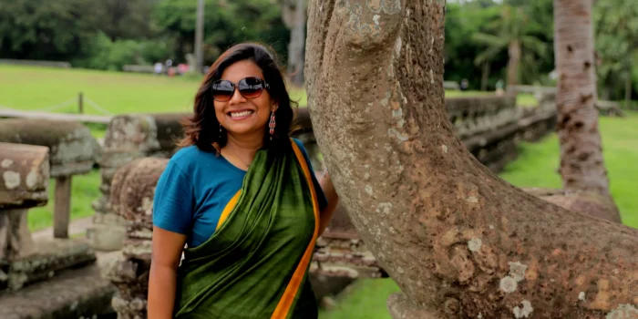 Exploring the ruins of Angkor, in Cambodia, in a saree.