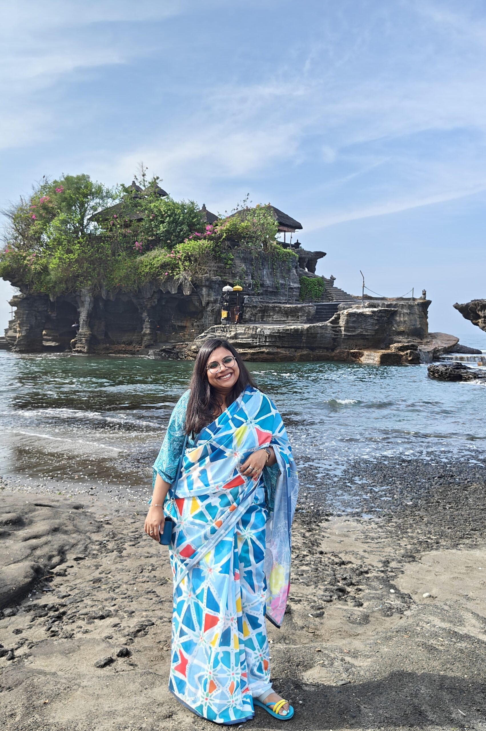 In Canggu (Indonesia), with the Tanah Lot Temple in the background.